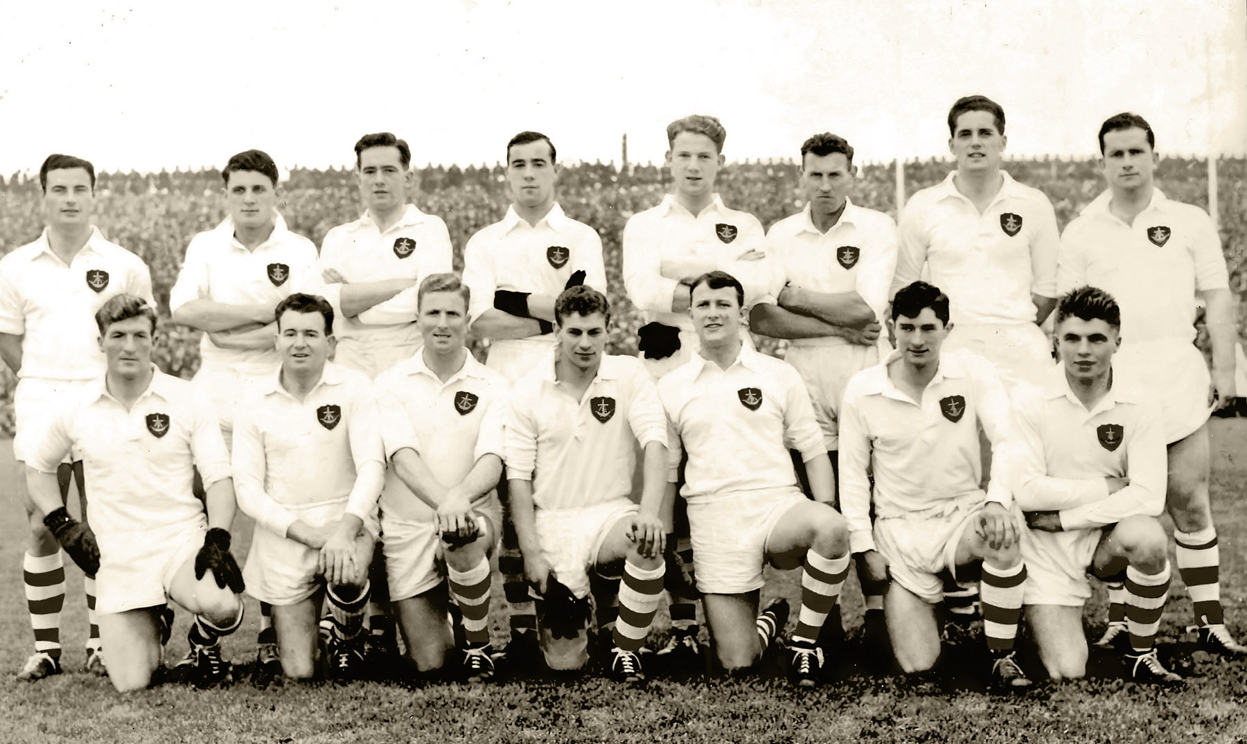 Galway All-Ireland Football Champions 1956Team photograph: Front Row: (left to right) Billy O’Neill (An Cead Cath), Jack Mangan (Tuam Stars) captain, Gerry Daly (Ballinasloe), Frank Stockwell (Tuam Stars), Jack Mahon (Dunmore McHales), Jackie Coyle (Ballygar), Sean Keely (Ballinasloe). Back Row: (left to right) Joe Young (An Cead Cath), Jack Kissane (An Cead Cath), Gerry Kirwan (Ballinasloe), Mick Greally (Ballygar), Mattie McDonagh (Ballygar), Tom Dillon (Ahascragh), Frank Eivers (Gardaí) and Sean Purcell (Tuam Stars).